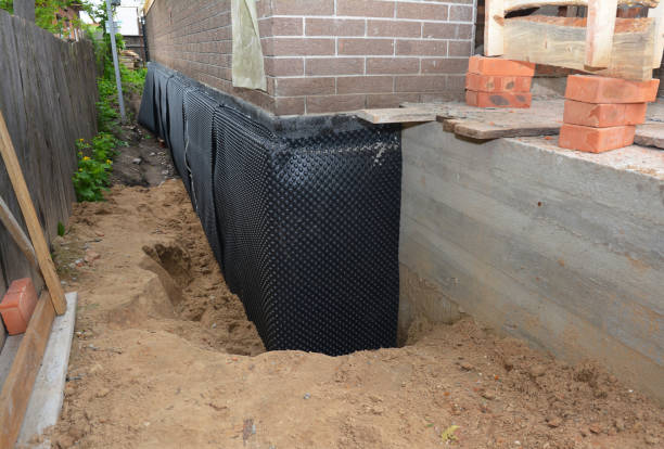 Happy homeowners after waterproofing job in Kouts